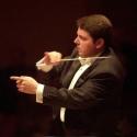 Conductor Andrew Litton: bouncing around like a rubber ball, busily keeping track